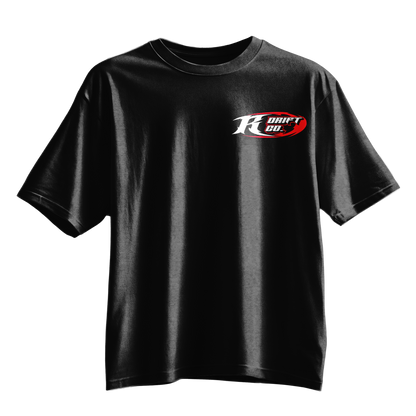 A black short-sleeve crewneck t-shirt featuring a 'Kraft Drift Co.' logo printed on the left chest in white and red, displayed against a solid white background.