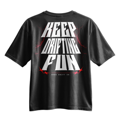 A black short-sleeve t-shirt with a large graphic on the back reading 'KEEP DRIFTING FUN' in bold white letters, accented with red lightning bolts and stars, and 'RACE DRIFT CO.' printed below.