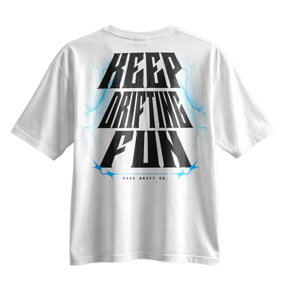 A white short-sleeve t-shirt with a bold graphic on the back reading 'KEEP DRIFTING FUN' in black stylized lettering, accented with red lightning bolts and the text 'MADE DRIFT CO.' underneath.